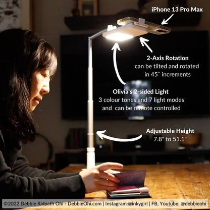 Author Using A Overhead Phone Stand In Dark With Light